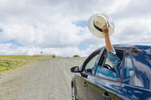 Waving Hat Out of Car