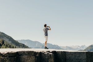 Man Taking Photo Off A Cliff