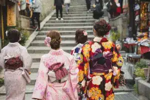 Group of Asian Women In Kimonos On Street