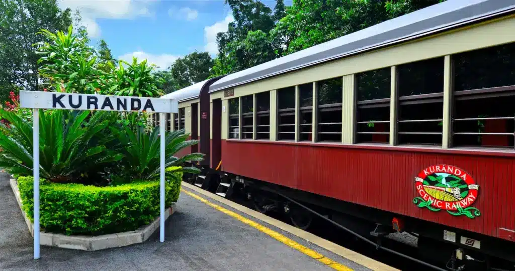 Kuranda Scenic Railway Sign Next To Train